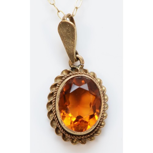 142 - A 9ct gold vintage oval cut citrine pendant with necklace, 1.7g