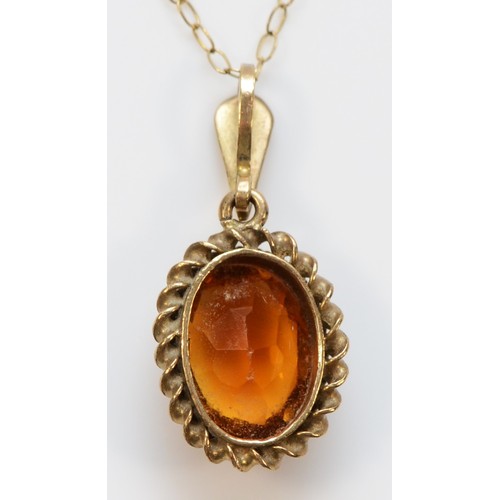 142 - A 9ct gold vintage oval cut citrine pendant with necklace, 1.7g