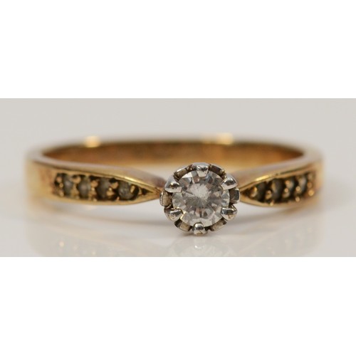 143 - A 9ct gold diamond solitaire ring with diamond shoulders, diamond weight approx 0.25cts, P, 2.4g