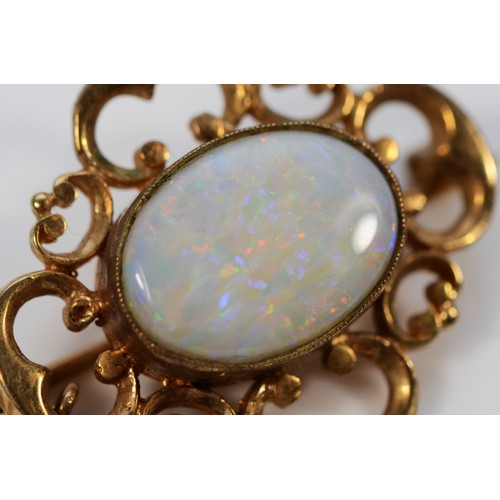 144 - A 9ct gold vintage opal brooch, 25mm across, 5.3g