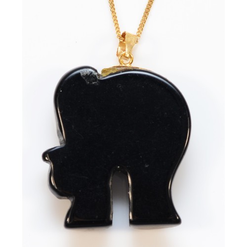 318 - A 9ct gold black onyx and ruby elephant pendant with necklace, 25mm elephant, 7.2g