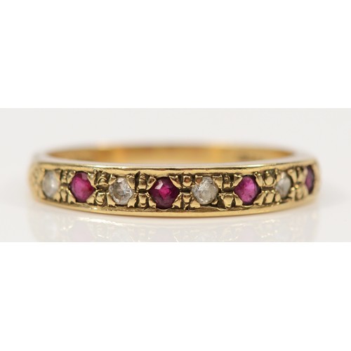 320 - A 9ct gold ruby and diamond half eternity ring, M, 1.8g