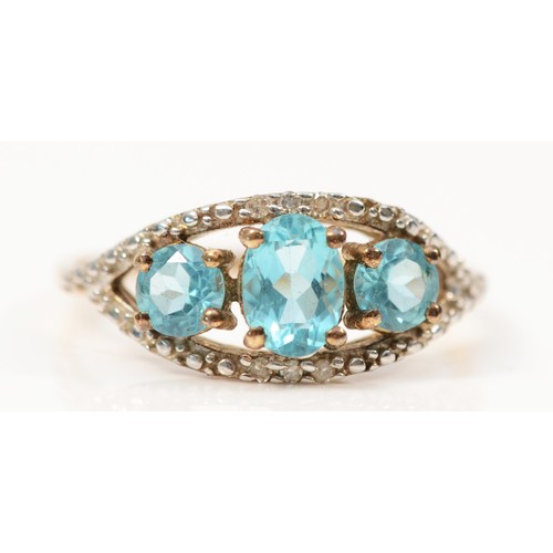 329 - A 9ct gold blue gemstone and diamond dress ring, claw set, S, 2.3g