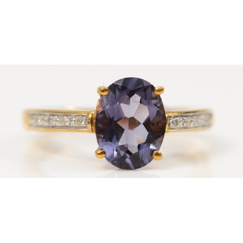 330 - A 9ct gold oval cut blue gemstone dress ring with diamond shoulders, L, 2g