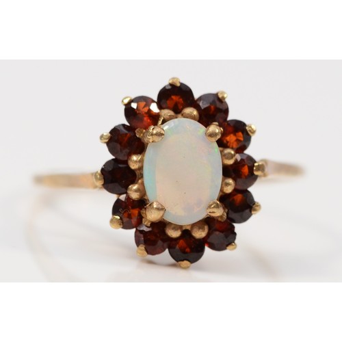 339 - A 9ct gold opal and garnet dress ring, N, 1.7g