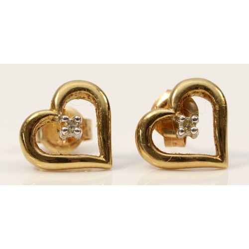 345 - A pair of 9ct gold diamond heart shaped stud earrings with scroll backs, 1.4g