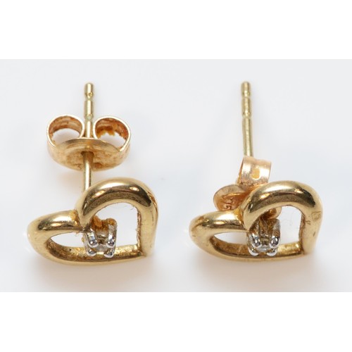 345 - A pair of 9ct gold diamond heart shaped stud earrings with scroll backs, 1.4g