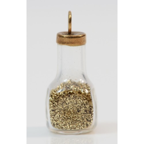 347 - A 9ct gold bottle of gold fragments charm, 15mm in length, 1.2g