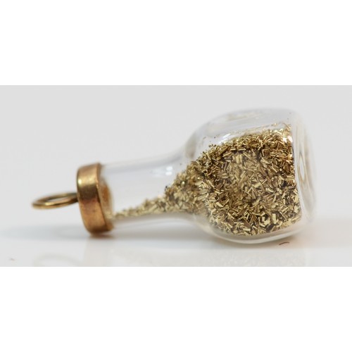 347 - A 9ct gold bottle of gold fragments charm, 15mm in length, 1.2g