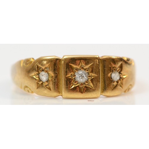 350 - An 18ct gold star set old mine cut diamond trilogy ring, N 1/2, 3.4g