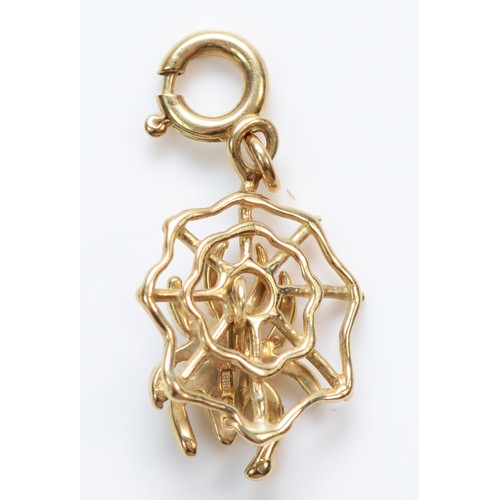 355 - A 9ct gold spider on web charm, 1.5g