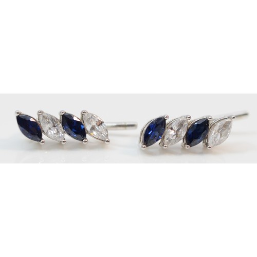 372 - A pair of 9ct white gold blue and white marquise cut cubic zirconia climber earrings, 1.3g