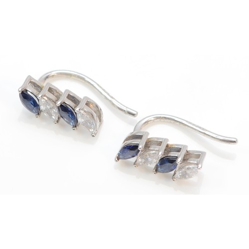 372 - A pair of 9ct white gold blue and white marquise cut cubic zirconia climber earrings, 1.3g