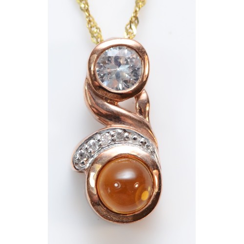 373 - A 9ct gold diamond accented, white sapphire and citrine pendant with necklace, 18mm pendant, 2.7g