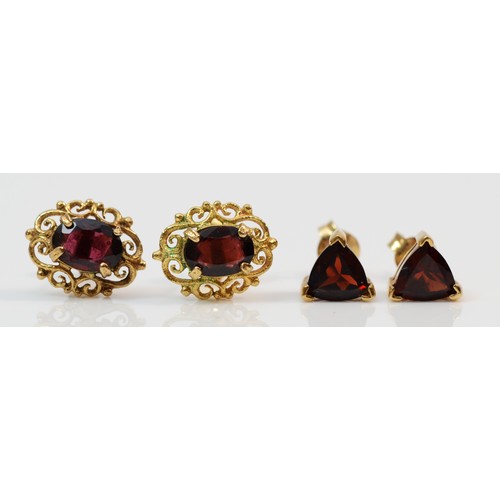 374 - Two pairs of 9ct gold garnet stud earrings with scroll backs, 2.9g