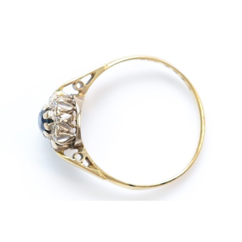 375 - An 18ct gold sapphire and diamond set cluster ring, N, 2.4g