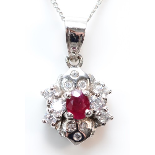 378 - A 14K white gold ruby and cubic zirconia cluster pendant with necklace, 8mm diameter, 2.4g