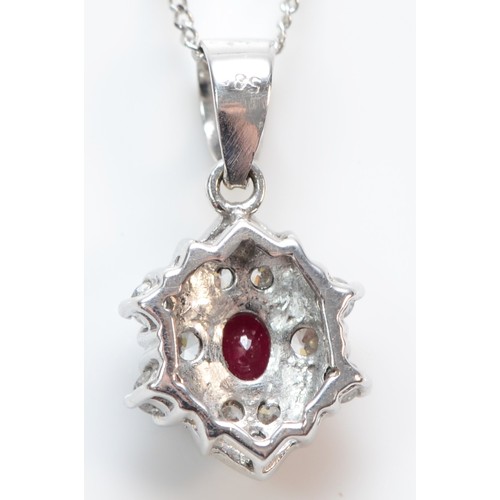 378 - A 14K white gold ruby and cubic zirconia cluster pendant with necklace, 8mm diameter, 2.4g