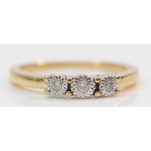 380 - A 9ct gold illusion set diamond trilogy ring, P, 2.8g