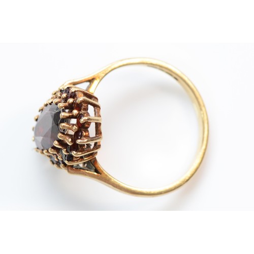 388 - A 9ct gold garnet cluster ring, M 1/2, 3.1g