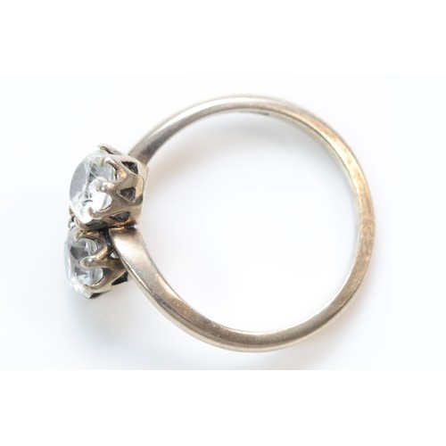 393 - A 9ct white gold white zircon bypass ring, K, 2.6g