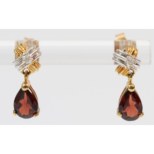 395 - A pair of 9ct gold diamond accented pear cut garnet drop earrings, 10mm drop, 1.4g