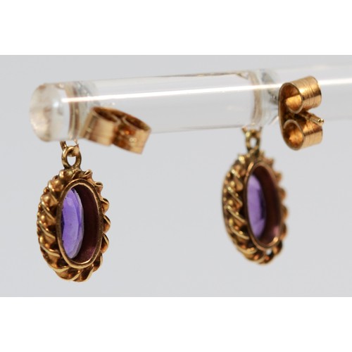 397 - A pair of 9ct gold rope edged oval cut amethyst drop earrings, 10mm drop, 1.8g