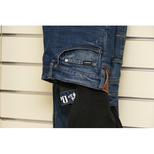 75 - A pair of Covec denim motorcycle jeans, having armoured inners, size 32L, together with a pair of Dr... 