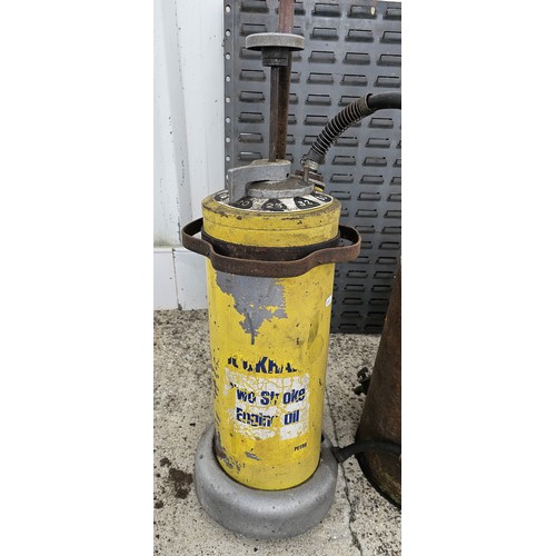 100 - WITHDRAWN FROM AUCTION
An Esso paraffin dispensing can, a two stroke forecourt trolley dispenser and... 