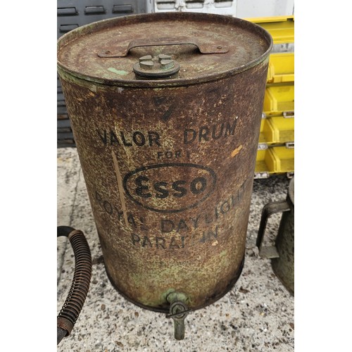 100 - WITHDRAWN FROM AUCTION
An Esso paraffin dispensing can, a two stroke forecourt trolley dispenser and... 