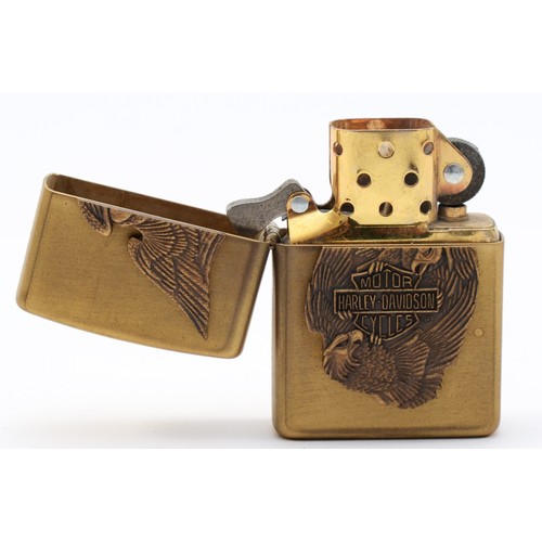 117 - A Zippo petrol lighter with Harley Davidson motif, in presentation tin