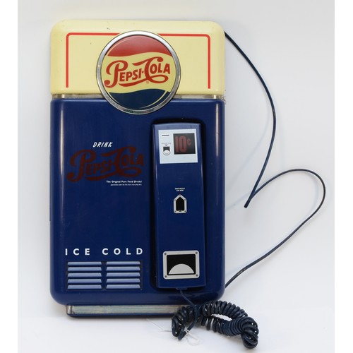 A Pepsi Cola wall mounted advertising telephone