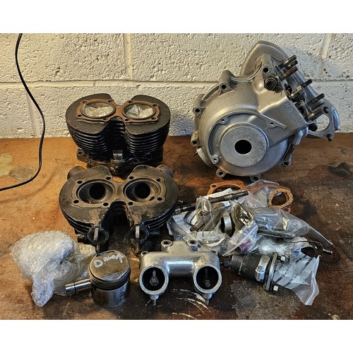 231 - A Triumph 5T pair of alternator crankcases, number 02897, a 5T cast iron head and barrel with piston... 