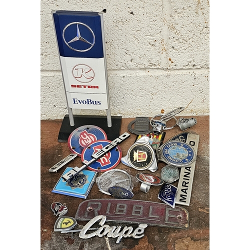 304 - A collection of car badges