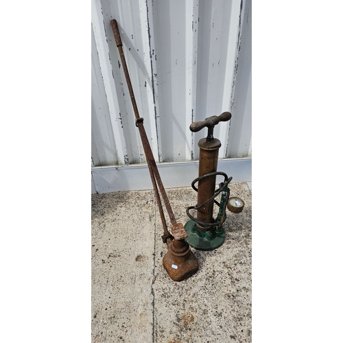 309 - A hand lever bottle jack and a brass hand pump dispenser