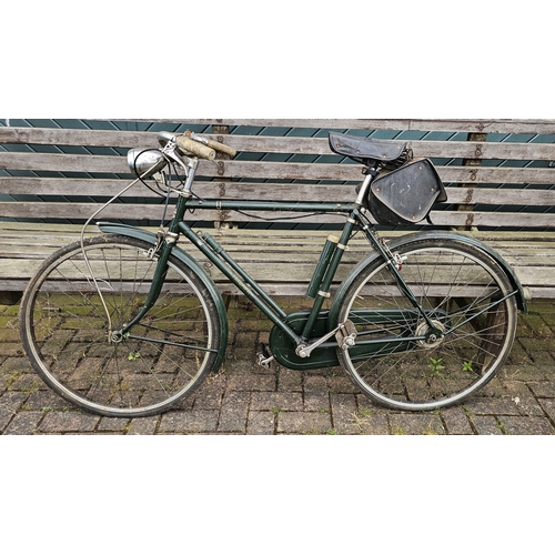 318 - A Triumph gentleman's bicycle, frame number 48423 NM, with speedo and lights