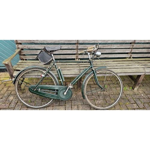 318 - A Triumph gentleman's bicycle, frame number 48423 NM, with speedo and lights