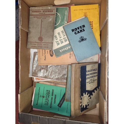 26 - A large collection of mid 20th century motor car related maintenance books, owners manuals, workshop... 