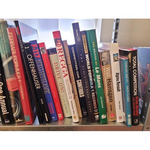 29 - A collection of motorsport books to include titles such as Offenhauser, Damon Hill, and the 2001 For... 