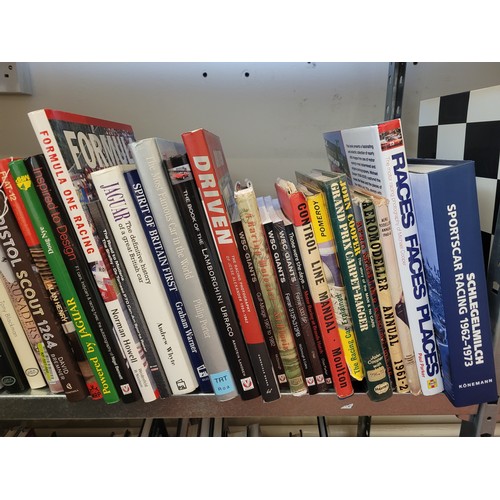 30 - A collection of motorsport books to include titles such as Jaguar, Jenson Button and Jackie Stewart