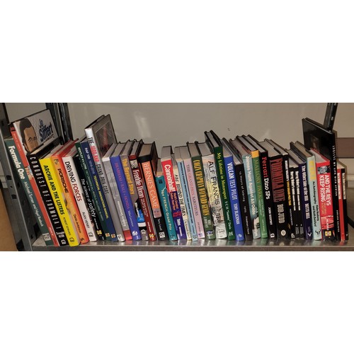 34 - A collection of motorsport books to include titles such as Canonball, Driving Forces, and Formula On... 