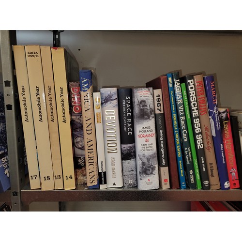 35 - A collection of motorsport books to include titles such as Devotion, Porsche 956 962, and Mansell