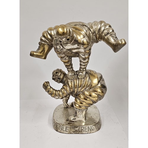 133 - A Michelin Tires Bibendum electroplated brass leap frog display figure, c.1980's, 30cm