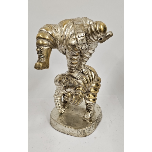 133 - A Michelin Tires Bibendum electroplated brass leap frog display figure, c.1980's, 30cm