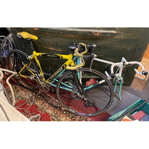 14 - A Specialized road racing bicycle, together with a Raleigh Equipe road racing bicycle (wheels need r... 