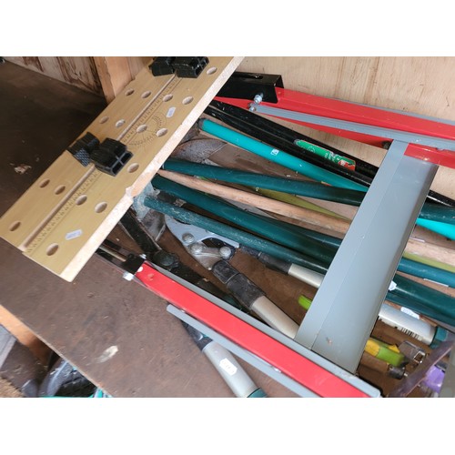 31 - Blackspur portable workbench, also a quantity of garden hand tools.