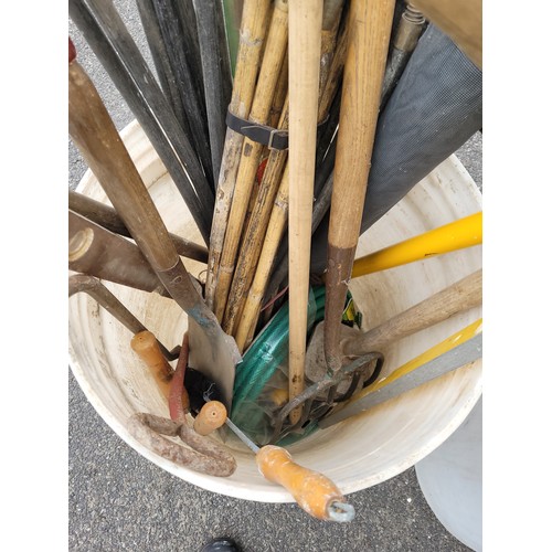 50 - 2 x large white tubs to contain a qty of garden hand tools to include spades, folks, brushes and rak... 