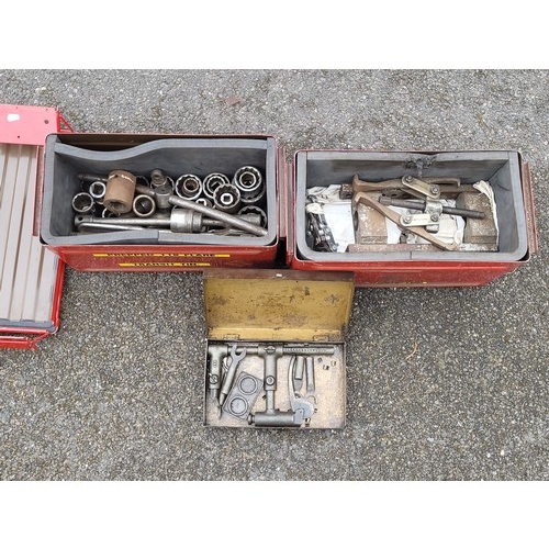 28 - 2 x red metal boxes containing sockets and various callipers.