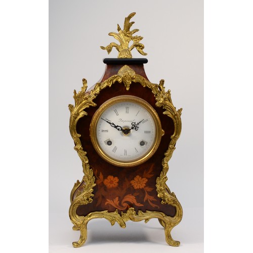 A 20th century Italian Imperial Rococo style 8 day mantel clock, with German movement striking on two bells. 38cm tall.