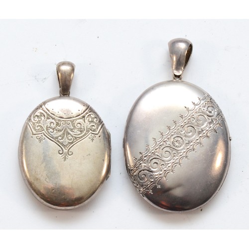 6 - A Victorian unmarked silver oval locket, 45 x 38mm and another smaller example, 27gm